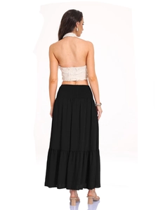 Detail of layered black tiered maxi skirt with lightweight textured fabric on model