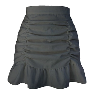 Detail of high waisted ruched skirt featuring ruffle hem in muted purple lavender