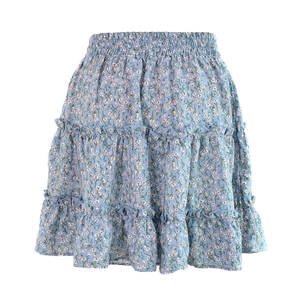 Detail of light blue floral mini skirt showing elastic smocked waist and ruffled tiers