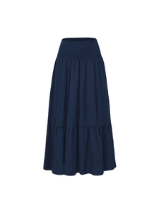 Detail view of high waisted navy smocked skirt with elastic waist and ruffled A-line hemline