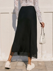 Jupe longue noire élégante avec fente latérale en tulle brillant et taille élastique