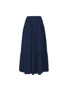 Detail view of navy blue tiered maxi skirt with smocked elastic high waist and pockets