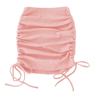 Detail of pink knitted mini skirt featuring adjustable side drawstrings and ruched texture