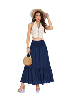 Detailed view of elastic smocked high waist and pleated tiered layers on a navy maxi skirt