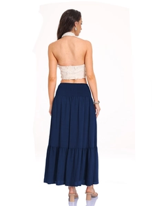 Back view of high waist navy tiered maxi skirt and cream halter neck lace top