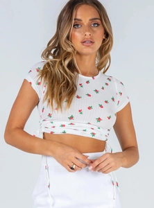 Detail view of the drawstring design and rose print on a white cropped t-shirt