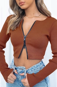 Detailed shot of brown ribbed knit crop top featuring adjustable double-way black zipper