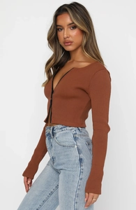 Detail view of brown ribbed long sleeve crop top with front zipper design