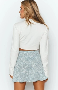 Back view of floral chiffon skirt with hidden zipper and high waist flare design