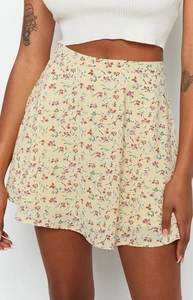 Detail shot of lightweight floral chiffon skirt featuring delicate red and purple print