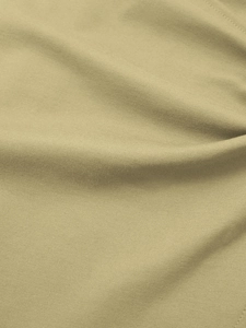 Détail macro d'un tissu en maille kaki clair de haute qualité avec un drapé doux élégant