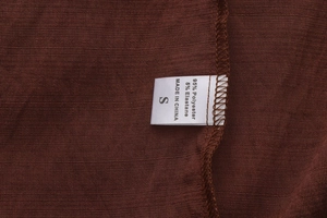 Detailed laundry tag of A-line skirt showing 95% polyester and 5% elastane fabric blend
