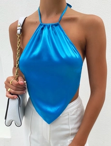 Detail of royal blue satin halter top featuring a pleated neckline and scarf-style hemline
