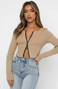 Detail of light brown ribbed knit top featuring a double-headed zipper closure for women