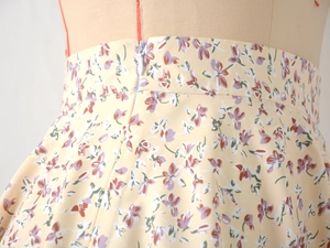 Close-up of floral print chiffon skirt featuring an invisible zipper and waist detail