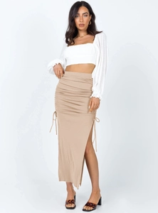 Detail view of ruching drawstring and side slit on high waist knit bodycon skirt
