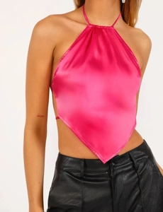 Detailed view of magenta satin halter top with bandana hem and silk-like finish
