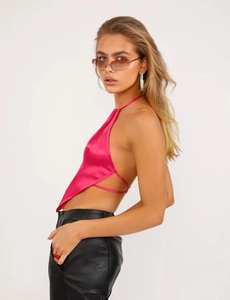 Detail of rose pink satin halter top featuring adjustable back ties and sleek texture