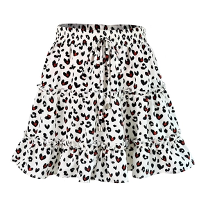Detail view of floral ruffle skirt with elastic waistband and decorative drawstrings