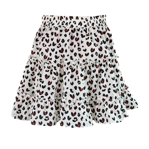 Detail view of high waisted tiered floral skirt with leopard heart print and elastic band