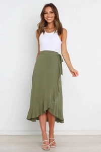 Detail of olive green wrap midi skirt showing tie-up bow and ruffled hemline