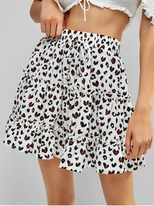 Detail of high waisted tiered mini skirt with leopard heart print and drawstring waist