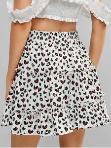 Detail view of high waist tiered ruffle skirt with leopard and heart print patterns