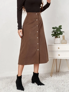 Detail view of coffee corduroy high waist skirt with single-breasted metal buttons