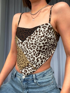 Detail of leopard print crop top featuring scarf-style hem and geometric patchwork design