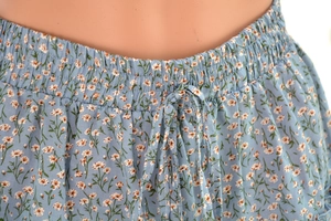 Close-up of the elastic waist and drawstring detail on the light blue floral skirt