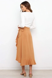 Detail view of a camel chiffon wrap skirt featuring layered ruffles and side tie closure