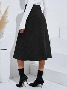 Detail view of high waist corduroy A-line midi skirt with vertical texture in black