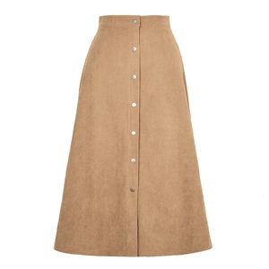 Detailed view of the corduroy texture and silver snap buttons on a long A-line skirt