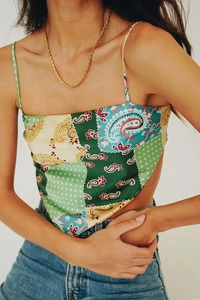 Detailed shot of silk-like paisley print halter top with bohemian pattern and thin straps