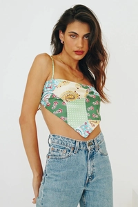Detail of handkerchief crop top with paisley print and a triangular hem design