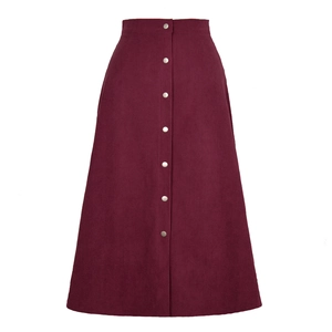 Detailed view of burgundy corduroy A-line skirt with vertical texture and metal buttons