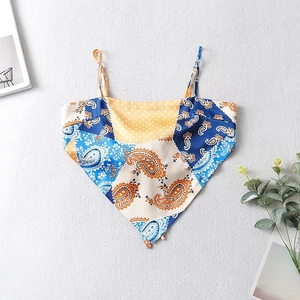 Detail of bohemian bandana crop top featuring paisley patterns and thin spaghetti straps