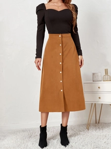 Detail of high waist corduroy A-line skirt with single-breasted white buttons