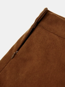 Detail of the high-waisted corduroy skirt featuring a sturdy hidden side zipper closure