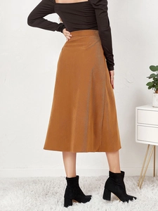 Back view of a high-waisted brown corduroy A-line midi skirt with vertical ribbed texture