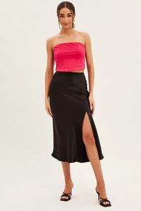 Detailed view of elegant high-waisted black satin skirt featuring a stylish side slit design