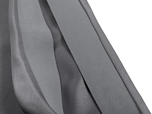 Macro detail of high-quality grey acetate satin skirt featuring neat double-stitched seams
