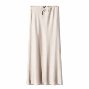 Detail of high-waist beige satin maxi skirt with drawstring ties and silky texture