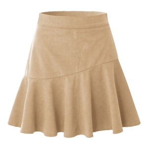 Detailed macro view of khaki corduroy fabric texture and ruffled hem on high waist skirt