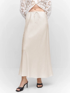 Detail of elegant satin maxi skirt with drawstring waist in pearl white fabric