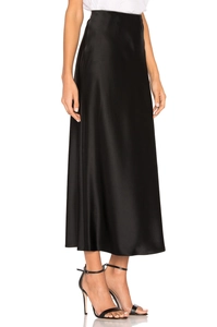 Detail view of high waist black satin midi skirt with elegant side slit and silk texture