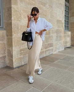 Elegant high waist champagne satin midi skirt styled with a casual white linen shirt