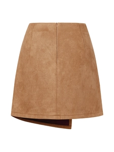 Detail of tan faux suede mini skirt featuring an asymmetrical hem and soft matte texture