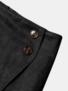 Close-up of matte faux suede skirt waist featuring tortoiseshell buttons and zip detail