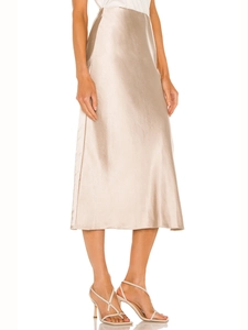 Detail view of champagne satin midi skirt showing silky texture and high waist side slit